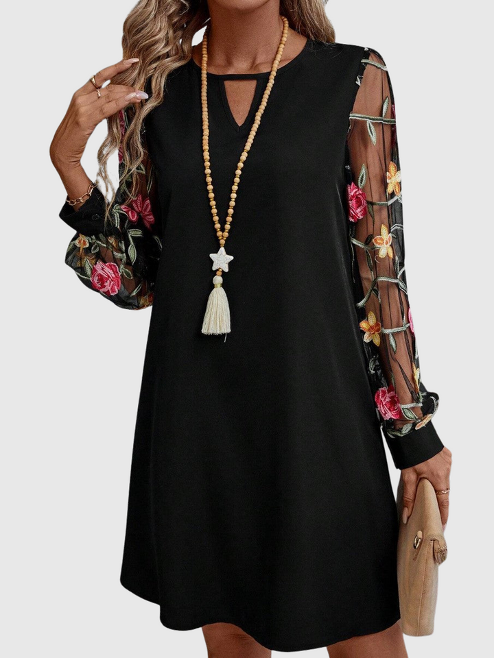 JOLANTA | Elegancka sukienka z dekoltem w kształcie litery V i wyrazistymi rękawami 